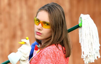 girl holding a mop